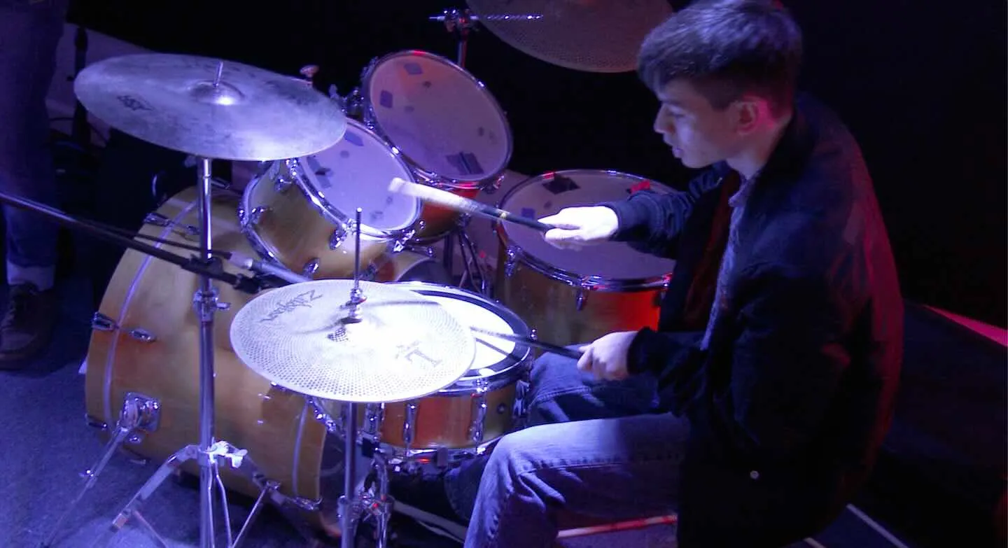 Drum lessons near me — student playing drums at Real Brave Oakland NJ