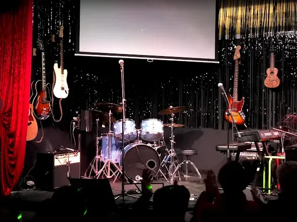 The Real Brave NJ stage — guitars, drums, and keys ready for showcase night